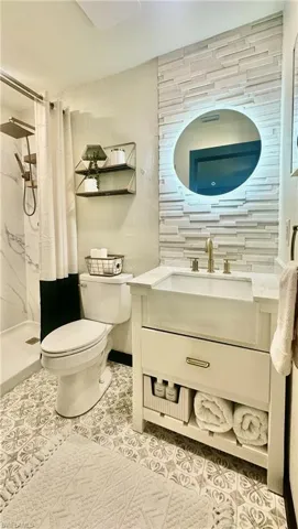 Updated bathroom with modern finishes.