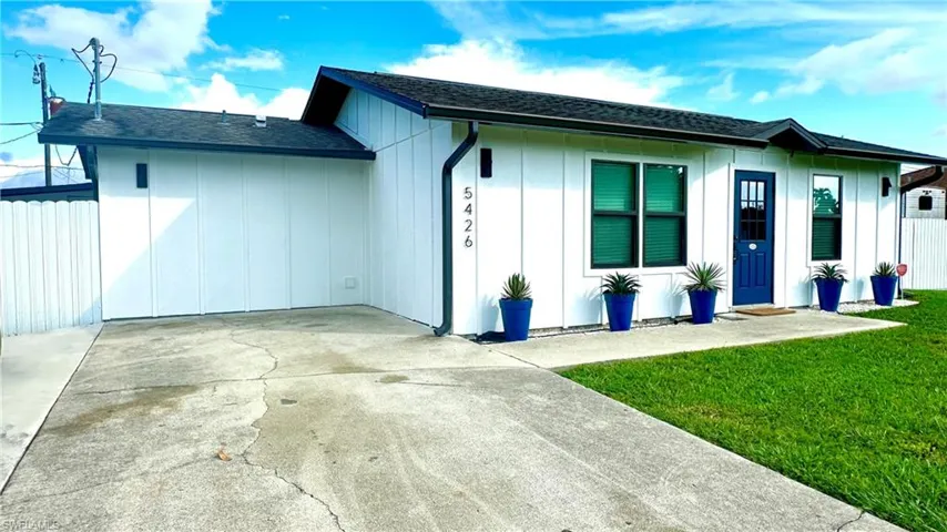 Hardie Board Siding Installed 2021, Reroof Installed 2019, Rain Gutters, Wide Driveway & a 12ft Wide Double-Gate Entry with Two Single-Entry Doors on Both Sides to Access the Backyard.
