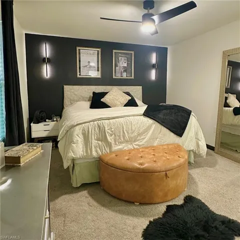 Spacious primary bedroom with natural light.