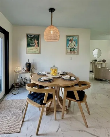 Dining Area with French Doors to the Outdoor Patio.