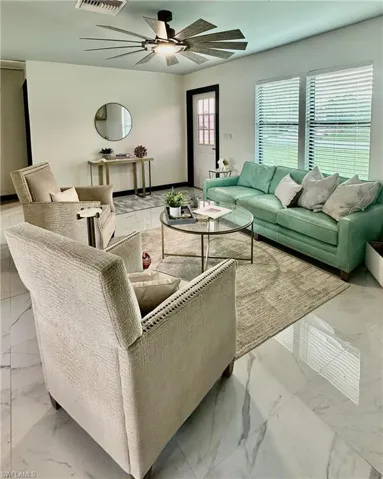 Bright living area with impact windows and natural light.