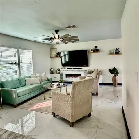 LED Electric Fireplace & 80-inch LG Flatscreen TV Included.