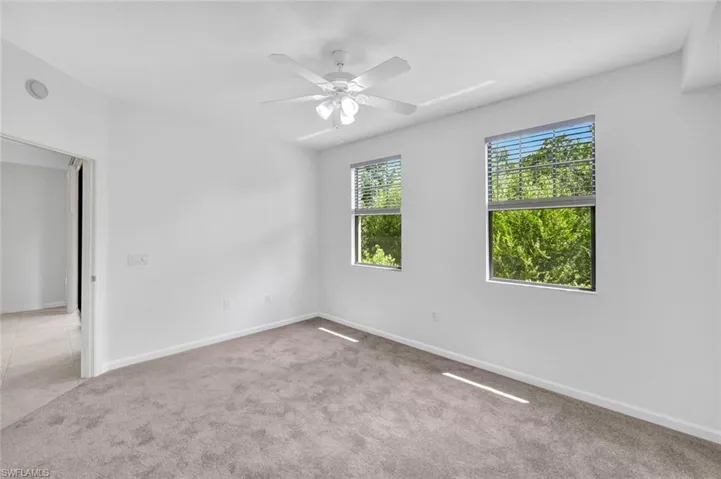 Spacious bedroom with double windows for a lot of natural light