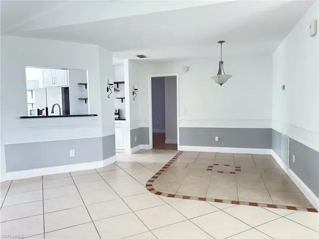 Formal dining area with tile floors
