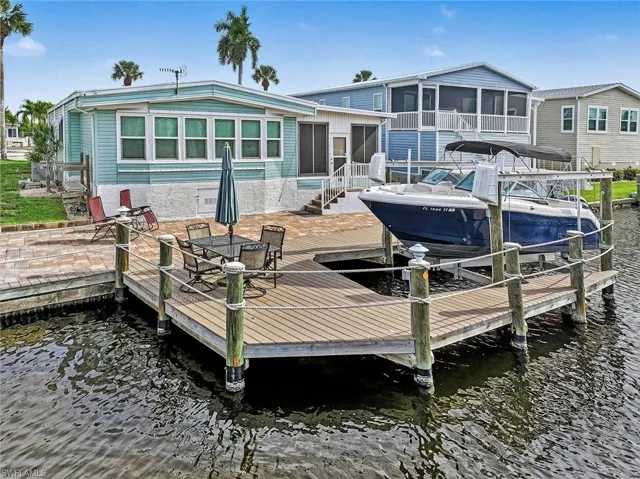 Beautiful, composite dock with 7,500lb. lift with pavered patio