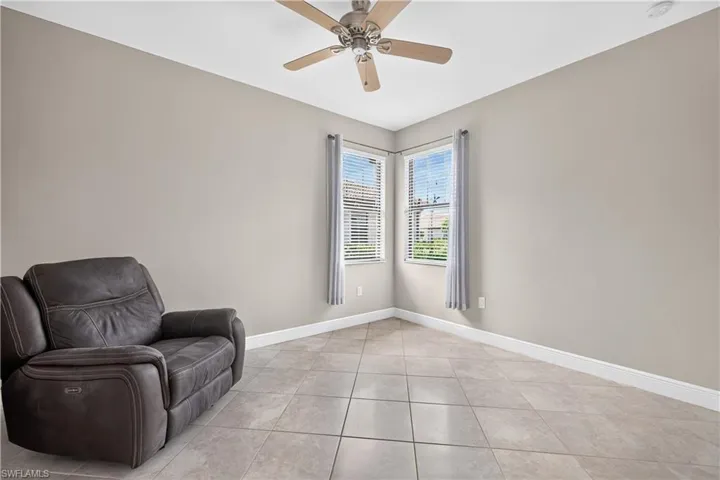 Neutral-toned walls complement the tile flooring