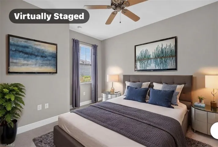 Carpeted bedroom featuring a window with blinds, ceiling fan, and light gray wall paint