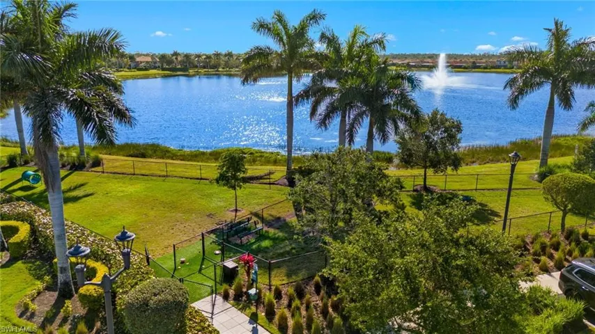 Dog park with an expansive waterfront setting featuring a large body of water with a prominent fountain
