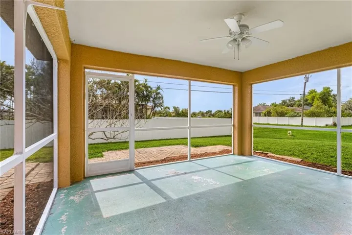 Screened patio featuring ceiling fan