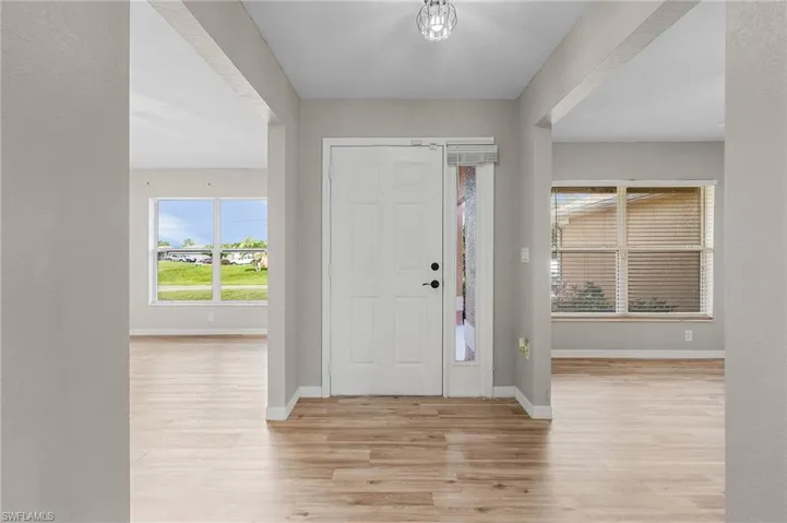 Entrance foyer with vinyl wood-style flooring