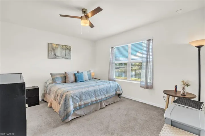Bedroom featuring carpet flooring and a ceiling fan