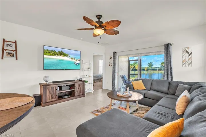 Tiled living area with a ceiling fan