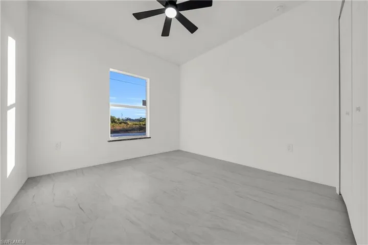 Unfurnished room with a ceiling fan