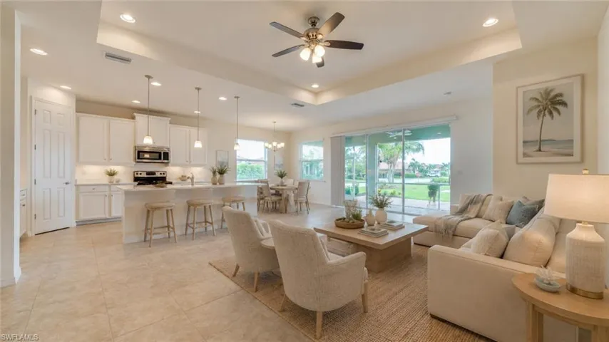 Virtual Open concept living area with tiled flooring throughout