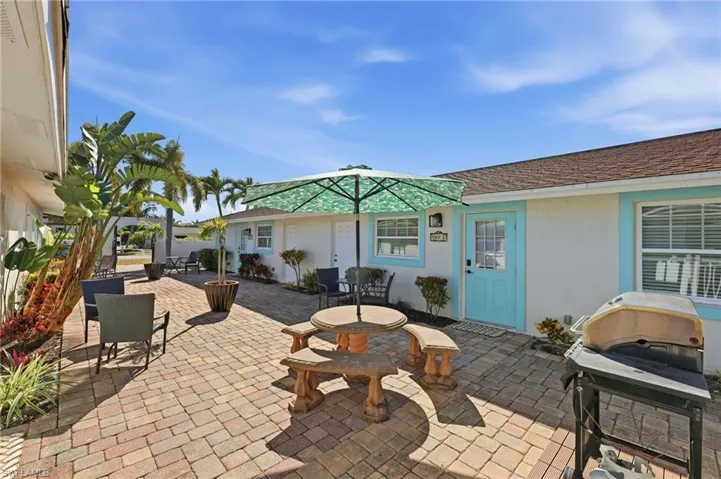 View of patio / terrace with area for grilling and outdoor dining area