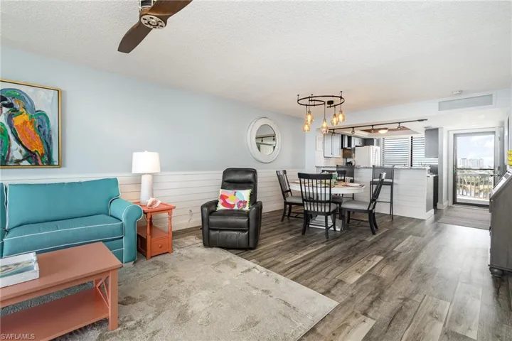 VIEW FROM LIVING AREA TOWARDS DINING, KITCHEN AND UNIT ENTRANCE