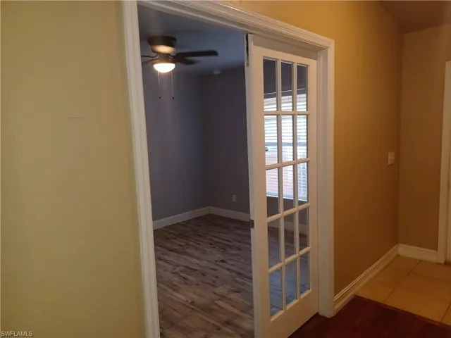 Spare room with ceiling fan and wood finished floors