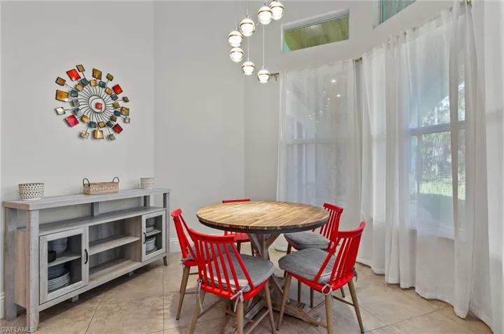 Dining space featuring light tile patterned floors