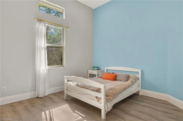 Bedroom featuring wood-type flooring