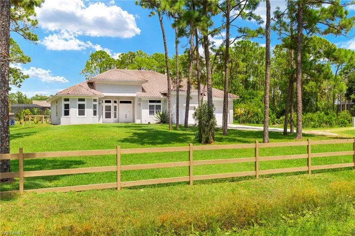 Mediterranean / spanish-style house featuring a front lawn