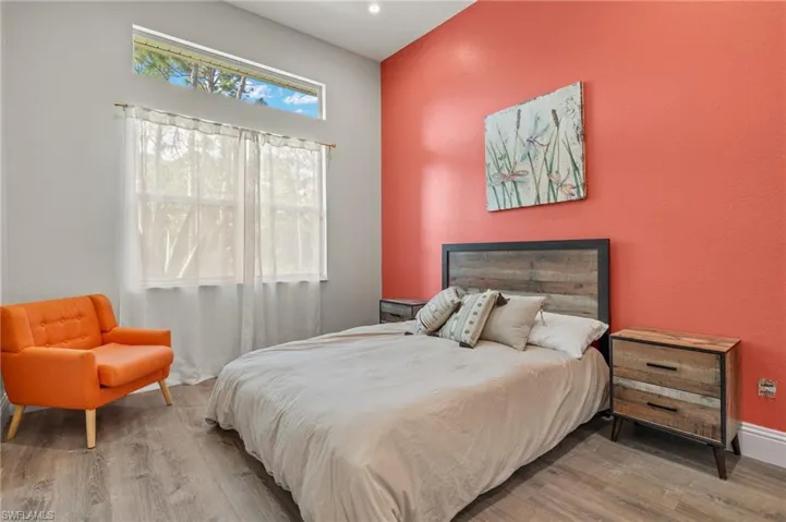 Bedroom with hardwood / wood-style floors