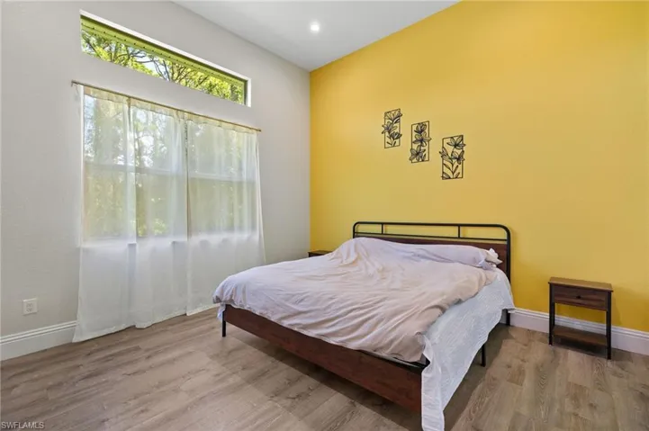Bedroom with wood-type flooring