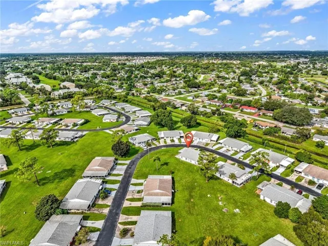 Residential community featuring paved streets and lush green spaces