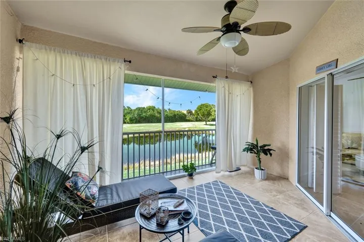 Spacious lanai showcasing wide water views and a serene backdrop of nature.