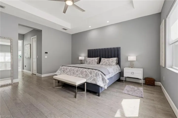 Primary suite with 3 walk in closets.