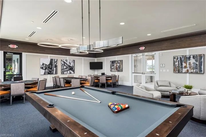 Game room with pool, poker tables, tv's.