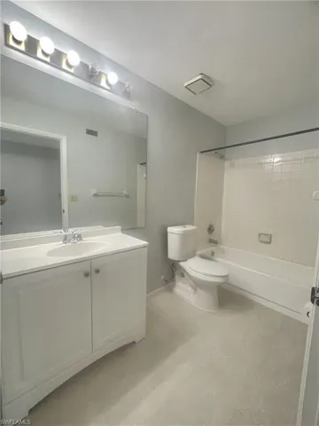 Full bathroom featuring vanity and shower / bath combination