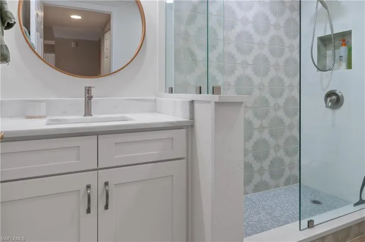 Bathroom featuring vanity and walk in shower