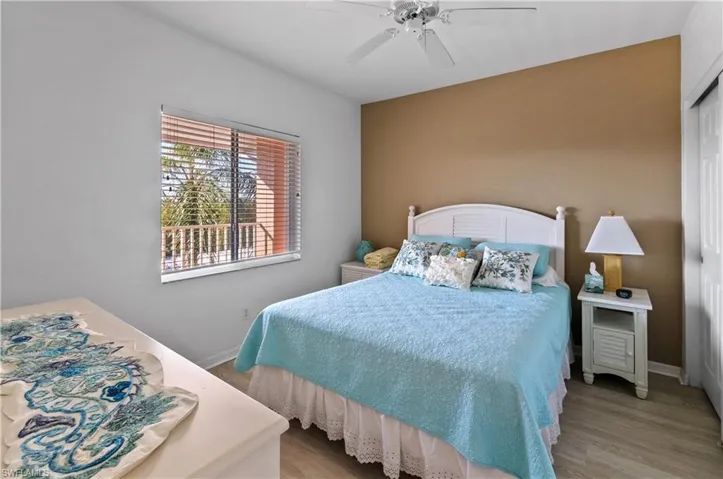 Bedroom with ceiling fan and light hardwood / wood-style flooring