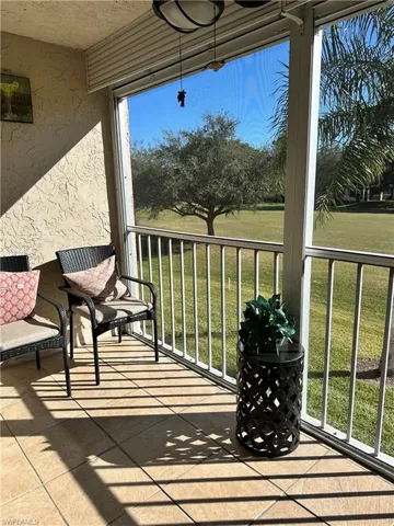 Balcony featuring a sunroom