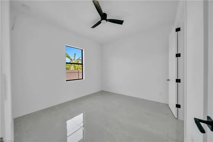 Unfurnished room featuring a ceiling fan