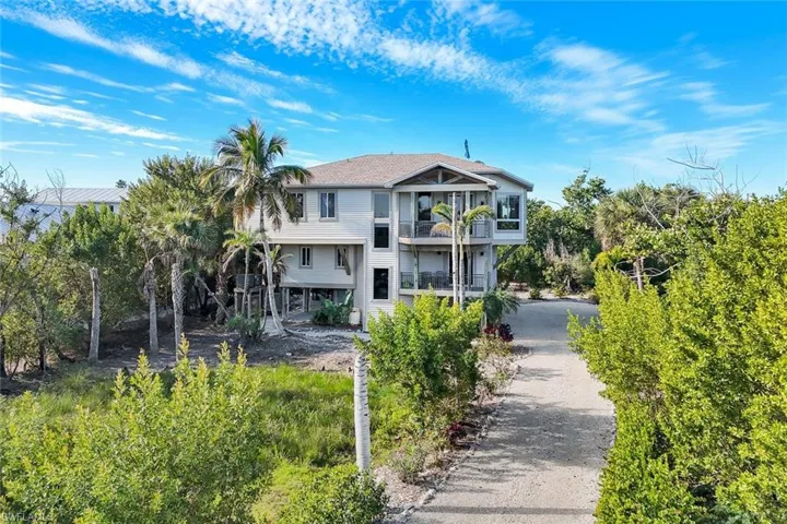 View of front of house with a balcony