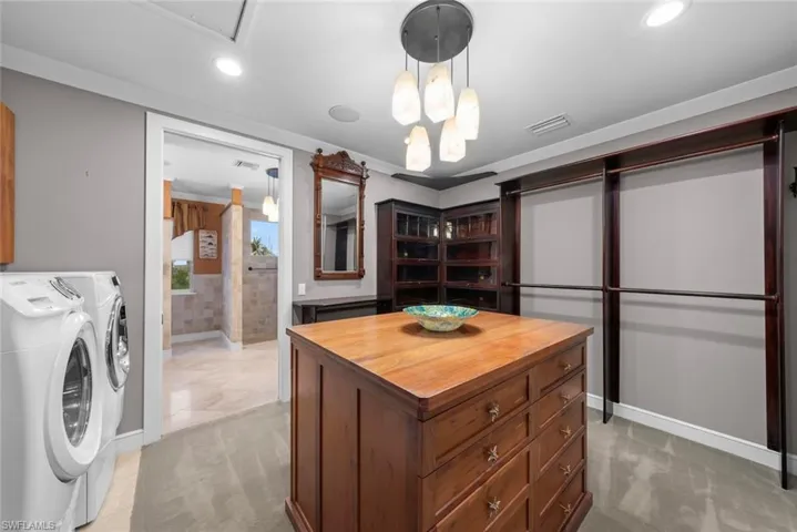 Primary's huge walk-in closet and laundry