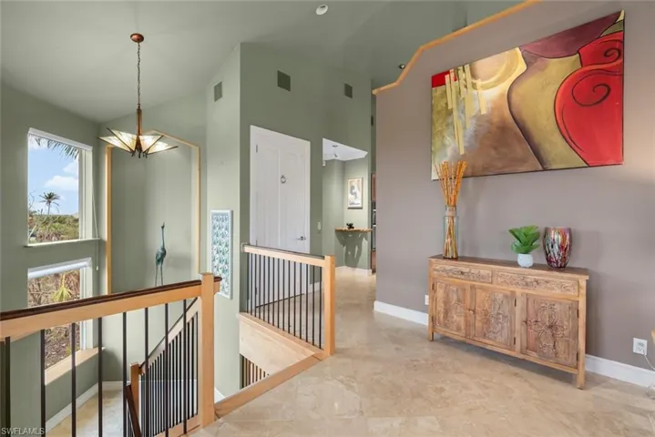 Staircase and Elevator entry to Living Room and Kitchen