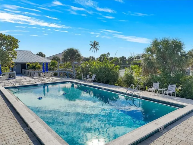 Community pool with a patio