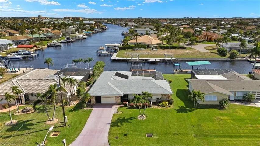 Aerial perspective of suburban area with a large body of water