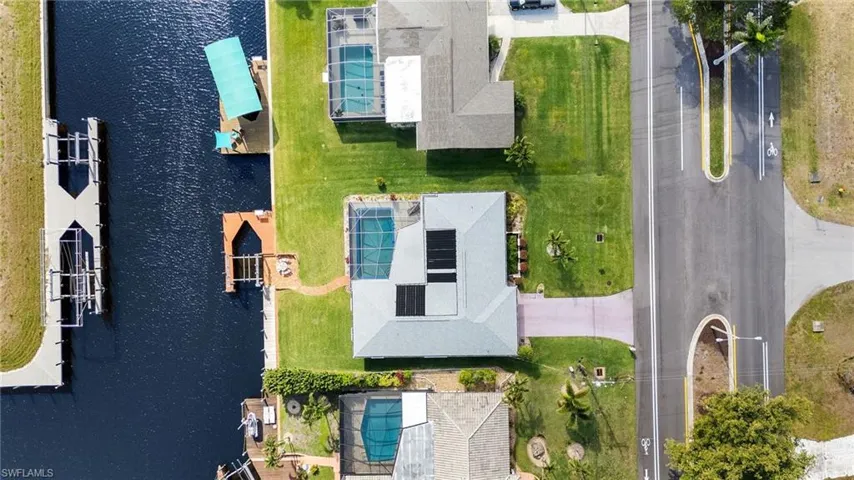 Aerial perspective of suburban area with a large body of water