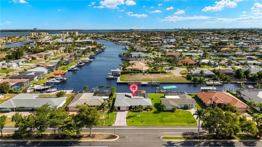 Aerial view of residential area with a nearby body of water