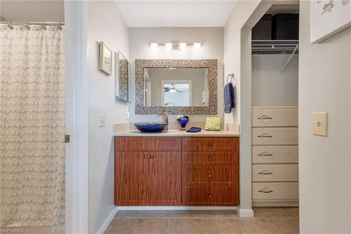 Bathroom with vanity and light tile patterned floors
