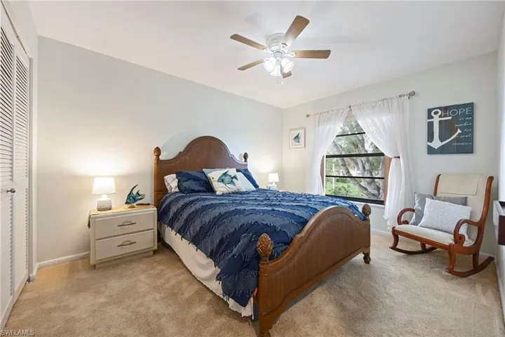 Bedroom featuring carpet flooring, ceiling fan, and a closet