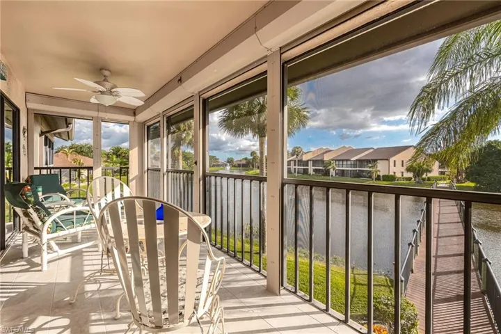 Unfurnished sunroom featuring a water view