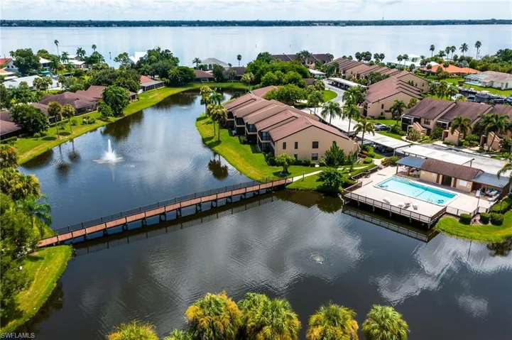 Aerial view of residential area featuring a large body of water
