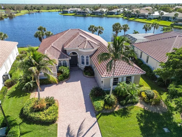 Lakefront estate home in Crown Colony with an east view