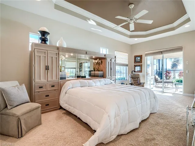Primary bedroom with sliders to lanai and pool