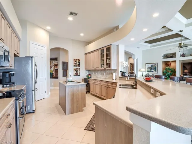 Prep sink island in the immaculate open kitchen