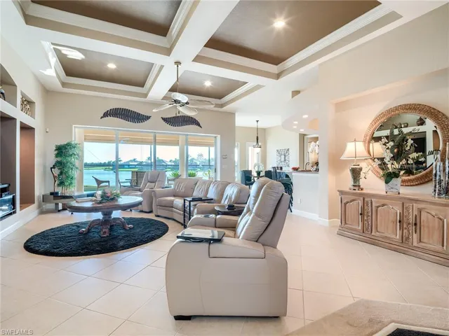View of great room upon entry.  Sliders to lanai and pool fully pocket open to disappear